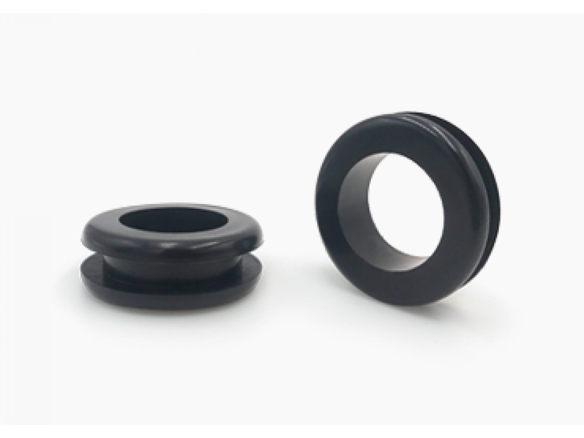 Two black PVC wiring grommets of different sizes, one displayed upright and the other on its side.