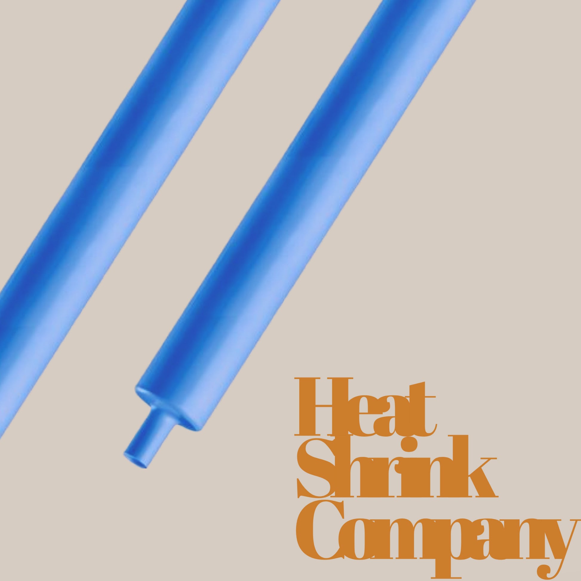 Two blue heat shrink tubes on a beige background, with text reading "Heat Shrink Company" in the lower right corner.
