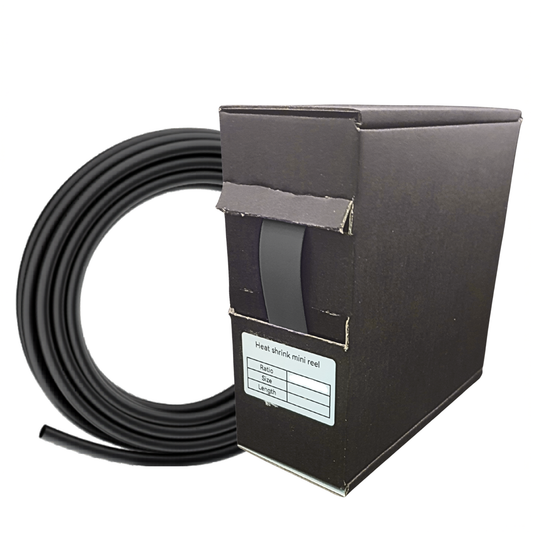 Black cable reel with cardboard box on a white background