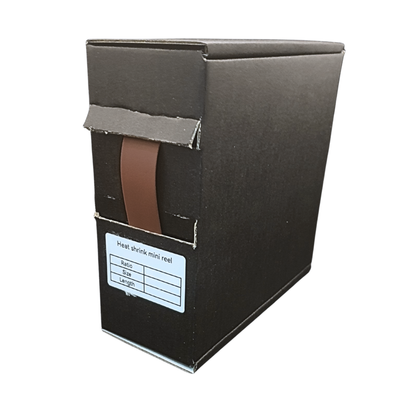 Black cardboard box with a brown strip and label on a white background