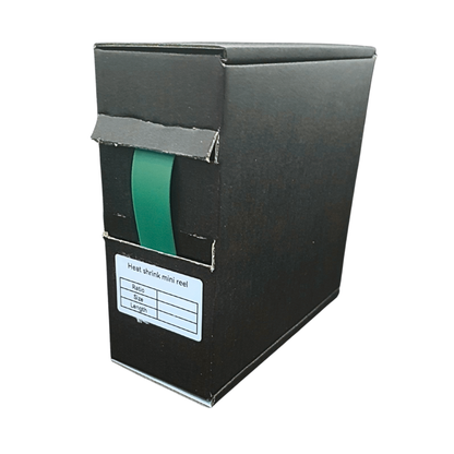 Black box with a green heat shrink mini reel inside on a white background